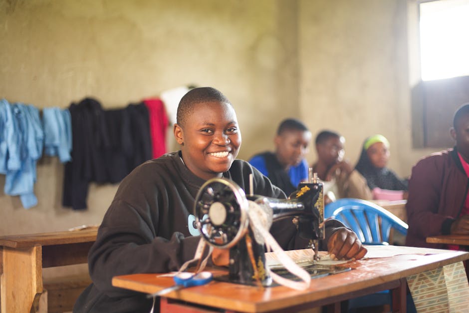 Ugandan youth learning tailoring skills